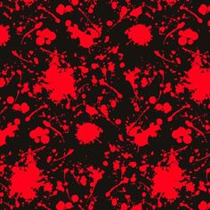 red and black paint splattered on a black background with white circles in the center