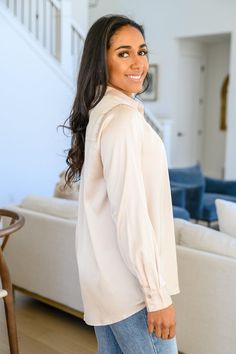 Treat yourself to a little luxury in the Loved For Years Satin Button Up In Beige. This dreamy top features a collared neckline that tops a functional button placket, ending at a double rounded hem. Long sleeves boast functional button cuffs for more styling versatility! Lightweight + No stretch 100% Polyester Wash cold, hang dry True to size *Measurements listed below are of the actual clothing item* S: Chest 40" Length 26"M: Chest 42" Length 27"L: Chest 44" Length 28"XL: Chest 46" Length 29"1X Chic Solid Blouse With Collared Neckline, Chic Solid Color Blouse With Collared Neckline, Feminine Button-up Blouse With Button Cuffs, Elegant Tops With Buttons And Collared Neckline, Feminine V-neck Blouse With Button Closure, Feminine Split Neck Blouse, Feminine Collared Tops With Buttons, Feminine Button-up Solid Color Blouse, Chic Solid Split Neck Blouse