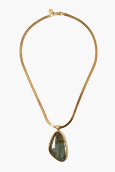 A luxurious labradorite pendant hangs from a sleek gold herringbone chain. A statement design perfect to wear on its own. 18k gold plated sterling silver, labradorite. 16" in length. Handmade in Vietnam. Unique Luxury Brass Necklaces, Luxury Gold Brass Necklaces, Luxury Brass Jewelry With Rectangular Pendant, Luxury Brass Plated Necklaces, Luxury Plated Brass Necklaces, Luxury Tarnish-resistant Brass Necklaces, Luxury Antique Gold Brass Necklace, Luxury Metal Necklaces With Stones, Luxury Mystical Labradorite Jewelry