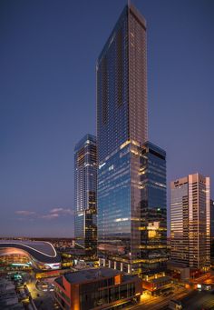 the skyscrapers are lit up at night