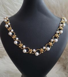 This is a lovely vintage gold plated necklace with white faux pearls.  It is very well made with a gorgeous design.  Can be layered with your other favorite pieces.  In excellent condition. Flawless. Great gift idea for your loved one or yourself.  Measurements: Length 23.5" Width about 12mm Jewelry boxes are only for display but each item will be wrapped and shipped safely in a gift box. Necklace With Pearls, Gold Diamond Jewelry, Gold Tone Necklace, Gold Plated Necklace, Jewelry Boxes, Gorgeous Design, Gold Gold, Vintage Necklace, Vintage Gold