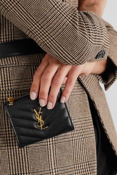 SAINT LAURENT's 'Monogramme' wallet has been made in Italy from glossy textured-leather and neatly quilted into chevrons. It's punctuated by a gleaming gold 'YSL' plaque - which is nothing short of iconic in the industry - and has a zipped coin pocket, plus space for bills.  Wear it with: [SAINT LAURENT Shoulder bag id1293748], [SAINT LAURENT Blazer id1265071], [SAINT LAURENT Tank id1265093], [SAINT LAURENT Pants id1265081]. Saint Laurent Pants, Saint Laurent Blazer, Summer Style Guide, Marketing Photos, Stylish Purse, Luxury Wallet, Girly Accessories, Exquisite Jewelry, Mr Porter