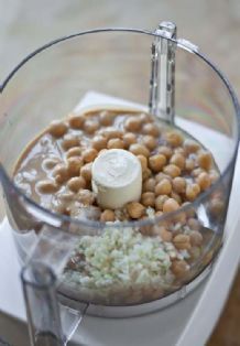 a food processor filled with beans and rice