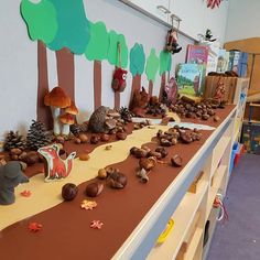 there are many toys on the shelf in this room, including mushrooms and other things