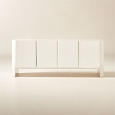 a white cabinet with three doors on the front and two drawers on the back side