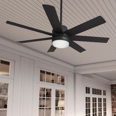 a ceiling fan mounted on the side of a wall in a room with white walls