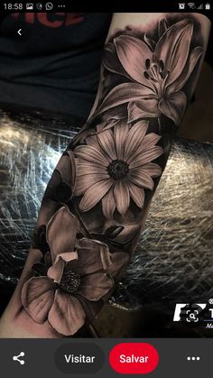 an arm tattoo with flowers on it and the words disponivel valor pronocian