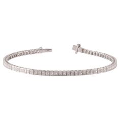 This is an elegant Diamond bracelet features 75 pieces of princess cut Diamond 4.72 carat in the channel setting, this bracelet entirely made in 18 karat White gold, this is a classic tennis bracelet. Classic Channel Set Diamond Bracelet For Wedding, Timeless Channel Set Bracelets For Wedding, White Gold Tennis Bracelet Channel Set For Wedding, Elegant Formal Channel Set Tennis Bracelet, Classic Channel Set Diamond Bracelet, Classic Channel Set Bracelet For Formal Occasions, Luxury Diamond Tennis Bracelet With Channel Set, Classic Diamond Tennis Bracelet With Channel Set, Classic Diamond Tennis Bracelet Channel Set