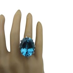 Stamped: 14K Total Ring Weight: 7.2 Grams Topaz Weight 33.57 Carat (22.75x18.00 Millimeters)Diamond Weight: 0.55 carat (F-G Color, VS2-SI1 Clarity )Face Measures: 27.90x21.50 Millimeter SKU: [600818] Formal Topaz Ring With Diamond Accents, Oval Blue Topaz Diamond Ring For Formal Occasions, Luxury Oval Topaz Ring For Formal Occasions, Pear-shaped Topaz Ring For Formal Occasions, Formal Blue Topaz Ring, Oval Topaz Gemstones For Formal Occasions, Formal Oval Topaz Ring With Prong Setting, Formal Oval Topaz Ring, Formal Oval Topaz Ring Hallmarked