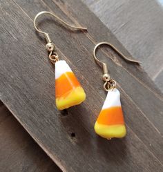 18k gold plated stainless steel earrings with glass candy corn pieces. Be sure to check out more HANDMADE jewelry in my shop, DizzleBees, beautiful jewelry of all kinds available! Made with quality materials and always nickel and lead free metals ♡ Perfect gift for a friend or loved one: All jewelry pieces are packaged in silver silk jewelry pouches, wrapped carefully, and packaged with love. Beautiful wrapping for gift ready giving. Personalized gift messages available. See Gift Wrapping at che Corn Earrings, Candy Corn Earrings, Candy Earrings, Candy Corn Halloween, Gold Candy, Silk Jewelry, Jewelry Pouches, Silver Silk, Glass Candy