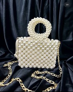 🌟 Elevate your style with this exquisitely crafted handbag adorned with pearl details. 🌟 Handcrafted with care, this bag is designed to add a touch of sophistication to every moment. The elegance of the pearl embellishments sets this bag apart, transforming it into a unique accessory. 🌸 Why Choose This Bag? 🌸 More than just an accessory, this bag is an opportunity to reflect your style and grace. Whether for a special event or to enhance your daily chic, this pearl-adorned bag complements every outfit perfectly. Consider gifting it to your loved ones to make their special moments even more meaningful. 🌟 Bag Size: 16x12 cm 🎁 Package Includes: 1 Handmade Bag with Pearl Details Carefully packaged, suitable for gifting 💌 Fast and Secure Delivery: Our products are meticulously packaged a Cream Evening Bag With Pearl Handle, White Evening Bag With Pearl Chain, Handmade Pearl Evening Bag In Cream, Handmade Cream Pearl Evening Bag, Beaded Pearl Bags For Events, Pearl Beaded Bags For Events, Rectangular Pearl Evening Bag With Pearl Embroidery, Cream Pearl Evening Bag With Pearl Handle, Event Pearl White Bag With Pearl Embroidery