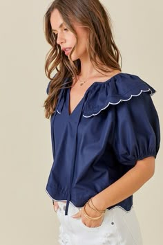 Short sleeve scallop hem top with a scallop collar. Runs true to size. Model is wearing a small (32” bust, 26” waist, 35” hips, 5’2”) Bust Waist Length Sleeve Length Small 44 inches 44 inches 17 inches 13 inches Medium 46 inches 46 inches 17 inches 13 inches Large 48 inches 48 inches 18 inches 13 inches We measure each item from side seam to side seam, on a flat surface. Please consider the fabric content of each item, as fabric containing stretch may have give. Scallop Collar, Dress Designs For Stitching, Basic Clothing, Embroidery Clothes, Fashion Inspiration Board, Scallop Hem, Hem Top, Basic Outfits, Scalloped Hem