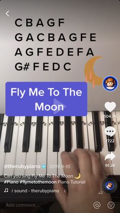 someone is playing the piano on their cell phone, and it says fly me to the moon