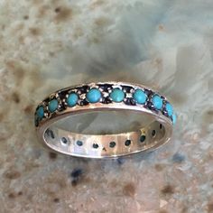 La la land This is a lovely multistone sterling silver eternity band with turquoise stones. if you wish to set different stones just let us know.(R2560) Construction & Dimensions: sterling silver, turquoise Approximate width: 4mm please indicate your requested size in the order. About our jewelry All of artisanfield jewelry collection is handmade. We make the artisanfield designs from a goldfilled wire. *If, for any reason, you are not completely satisfied, please message us so we can try to Turquoise Sterling Silver Jewelry For Promise, Turquoise Round Band Ring For Anniversary, Promise Ring In Turquoise Sterling Silver, Elegant Multi-stone Turquoise Ring In Sterling Silver, Silver Stackable Turquoise Ring For Anniversary, Turquoise Stackable Round Band Rings, Stackable Sterling Silver Turquoise Ring For Wedding, Sterling Silver Stackable Turquoise Ring For Wedding, Wedding Stackable Turquoise Ring In Sterling Silver