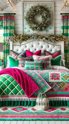 a bed covered in green and pink pillows next to a window with christmas lights on it