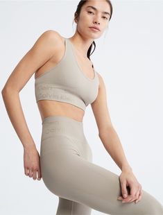 Cut with a high rise waist, these performance-ready leggings feature a ribbed texture throughout with sheer styling. Made with a form-fitting silhouette for limitless movement. Detailed with Calvin Klein logo styling at the waist.  Material: 95% Nylon, 5% Spandex. Ribbed Texture, Fashion Logo, Calvin Klein, High Rise, Spandex, Leggings, Texture, Lighting, Pants