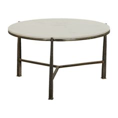 a white marble top coffee table with metal legs