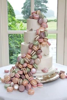 a wedding cake with macaroons on it