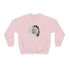 a pink sweatshirt with an image of the earth on it