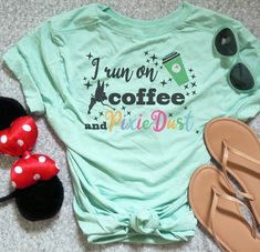 All you ever need is a little coffee and pixie dust! This Tinkerbell inspired t-shirt includes that essential to go coffee cup, Tink herself and as much pixie dust as we could find! All in a color font. If you need a little extra motivation to get stuff done grab this Disney Coffee and Pixie Dust shirt for your next pr Tinkerbell Shirt, Disney Coffee, To Go Coffee, Disney Races, Run Disney Costumes, To Go Coffee Cups, Tinkerbell Disney, Get Stuff Done, Disney T