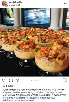 some kind of appetizing dish on a table with wine glasses in front of it