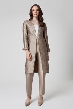 £650.00 CHAMELEON COLLECTION Made to Order: Taupe sateen trousers with pressed-crease detail. Perfect for an evening occasion and can be paired with the Taupe Vicky Coat for an elegant Mother of the Bride look. If you are interested in these trousers, please visit us in the boutique where our friendly staff will help you to create your perfect outfit. Book an appointment (Please allow 3 months for your order to be made) Made in London. Fabric Composition: 90% Silk, 10% PA Dry Clean Only Mother Of The Bride Pants Outfit, Mother Of The Bride Trouser Suits, Mother Of The Bride Looks, Mother Of The Bride Suits, Elegant Signature, Mother Of Bride Outfits, Silk Coat, Alencon Lace