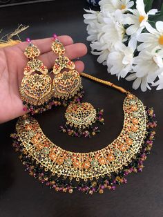 Prepare yourself for wedding season which is around the corner! Be happy while creating your royal looks and be on top of your style game in a room full of people. This bridal set is an example of perfection with extraordinary touch for someone beautiful like you! Beautifully crafted in Hyderabadi naratan stones and gold plating for a royal look on your big day! Set included: necklace, earrings and mang tikka In stock and ready to ship. Hand crafted and gold plated kundan indian/pakistani jewelr Meenakari Jewelry For Marriage On Diwali, Meenakari Jewelry For Marriage And Diwali, Traditional Meenakari Jewelry For Marriage, Gold Peacock Design Jewelry Sets For Weddings, Wedding Kundan Bridal Necklace With Peacock Design, Wedding Bridal Necklace With Kundan And Peacock Design, Festive Meenakari Jewelry For Marriage, Meenakari Chandbali Jewelry For Marriage, Meenakari Chandbali For Marriage