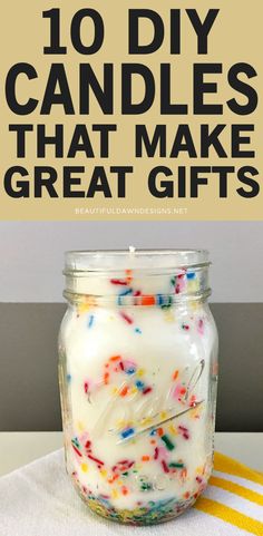 a jar filled with white candles and sprinkles on top of a table