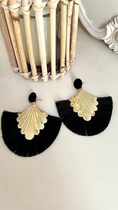 Beautiful boho statement black and gold tassel earrings.  7cm long  Lightweight. Black Fringe Dangle Chandelier Earrings, Chic Evening Earrings With Tassels, Elegant Black Fringe Chandelier Earrings, Black Fringe Tassel Drop Earrings, Elegant Black Dangle Tassel Earrings, Chic Tassel Earrings, Elegant Black Tassel Drop Earrings, Black Tassel Drop Earrings For Evening, Black Tassel Earrings For Evening