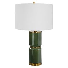 a green table lamp with a white shade