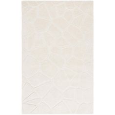 a white rug with an abstract design on it