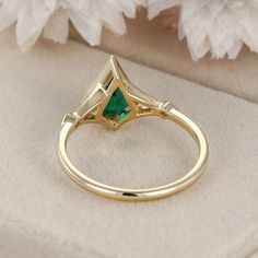 Step into the enchanting world of Art Deco with this stunning kite cut lab emerald ring. Meticulously crafted in 14k yellow gold, this ring embodies the elegance and glamour of the 1920s era. With its geometric lines, intricate details, and vibrant lab emerald, this masterpiece is destined to captivate hearts and turn heads. Elegant Trillion Cut Emerald Ring, Elegant 14k Gold Marquise Cut Emerald Ring, Marquise Emerald Ring In Yellow Gold, Marquise Emerald Ring In Gold, Gold Marquise Emerald Ring, Elegant Trillion Cut Emerald Promise Ring, Diamond Bezel Ring, World Of Art, Bezel Ring