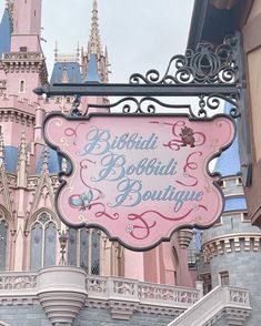 there is a sign for the entrance to disneyland's boudoty boutique