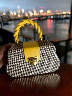 Experience luxury with our Geometric Light Weight Yellow Hand Bag. This sophisticated, exclusive piece is the perfect addition to your wardrobe. Its intricate pattern and high-quality materials make it both elegant and durable. Whether for a chic vacation or a day in the city, its chain and top handle strap provide versatility while the 100% polyurethane coating ensures long-lasting beauty. Treat yourself to this must-have piece and elevate your style to a new level. Size Bag Height Bag Length B Geometric Light, Geometric Lighting, Hand Bag, Top Handle, The City, Size 4, Long Lasting, Wardrobe, Handbags