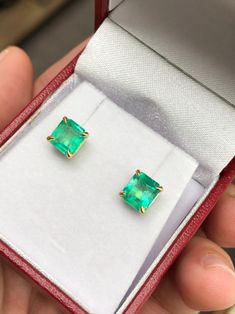 Featured here is a beautiful set of emerald cut Colombian emerald studs in fine 14K yellow gold. Displayed are medium-green emeralds with very good transparency, accented by a simple four-prong 14K gold mount, allowing for the emerald to be shown in full view. The earth mined, green Colombian emeralds have a desirable lush green color with excellent qualities. These earrings are ideal for everyday use and are the perfect accessory to any outfit. Total Carat Weight: 2.0cts Setting Style: Four Pro Green Baguette Cut Earrings For Gifts, Fine Jewelry Baguette Cut Emerald Earrings, Baguette Cut Emerald Earrings As A Gift, Emerald Cut Green Gemstone Earrings, Fine Jewelry Emerald Cut May Birthstone Earrings, Fine Jewelry Emerald Cut Earrings For May Birthstone, May Birthstone Emerald Cut Fine Jewelry Earrings, Emerald Cut Green Earrings, Emerald Cut Emerald Earrings In Yellow Gold