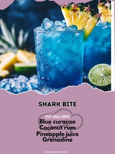 a blue cocktail with pineapple and lime garnish on the side, in front of an advertisement for shark bite