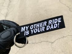 a keychain that says, my other ride is your dad on the front