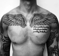 a shirtless man with tattoos on his chest and wings tattooed on his chest is looking at the camera