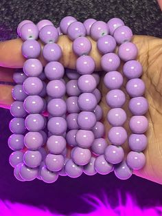 Royal Arm Candy Individual Bracelets feature 8mm or 10mm beads, making it the ideal accessory to adorn your arm and amplify its allure. What do you get: 1 bracelet Fits a 7" wrist but can stretch bigger 10mm beads Purple Beaded Bracelets With Large Beads, Purple Beaded Bracelet With Large Round Beads, Purple Bracelets With Large Beads, Purple Stretch Bracelet With Large Round Beads, Hypoallergenic Rosary Bracelet With Round Beads, Purple Stretch Bracelet With Spacer Beads, Purple Stretch Bracelet With Spacer And Round Beads, Flexible Stretch Bracelet With Round Beads, Beads Making