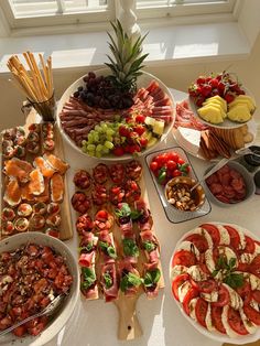 a table topped with lots of different types of food