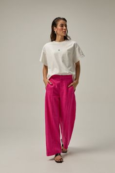 Made of 100% linen fabric, these pants have an elastic waist for added comfort and a straight cut to lengthen the legs. You can wear it high-waisted or on the hips for a more modern look. Our Reverie collection represents the idea of reconnecting with one's creative self and finding inspiration through moments of deep contemplation and imaginative thinking. COMPOSITION AND CARE Material: 100% linen Linen is one of the most sophisticated natural fiber fabrics. It does not hold or block air, nor d Pink Flowy Pants Outfit, Hot Pink Linen Pants Outfit, Modern Linen Wide-leg Pants, Modern Wide-leg Linen Pants, Modern Linen Trousers, Modern High-waisted Linen Wide Leg Pants, Modern Wide Leg Linen Pants, Modern Linen Wide Leg Pants For Workwear, Modern Linen Straight Leg Bottoms