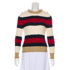 From The 2016 Collection. Ivory And Multicolor Gucci Wool Medium-Weight Knit Sweater With Cable Knit Pattern Throughout, Stripe Pattern, Metallic Trim At Edges, Crew Neck And Dual Interlocking Gg Button Closures At Shoulders. Size Not Listed, Estimated From Measurements. Fabric: 100% Wool; Trim 70% Viscose, 30% Metal Beige Gucci Long Sleeve Sweater, Gucci Beige Long Sleeve Sweater, Fitted Designer Gucci Sweater, Designer Fitted Gucci Sweater, Elegant Gucci Sweater For Winter, White Fitted Designer Sweater, Designer Fitted White Sweater, Gucci 2018, Gucci Sweater