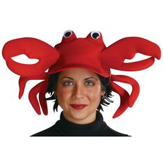 a woman wearing a red hat with two eyes and a crab on it's head