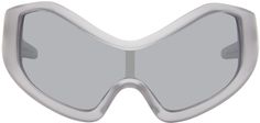 Shield-style semi-transparent bio-circular acetate-frame sunglasses in gray. · Mirrored silver-tone Poly Renew lens · 100% UVA/UVB protection, Category 3 · Integrated nose pads · Logo etched at temple · Exposed core wire · Includes pouch · Size: 144. 120 Designed in collaboration with Welcome Studios, an ISCC Plus-certified Eden Projects contributor. Available exclusively at SSENSE. Supplier color: Matte crystal/Silver mirror Modern Gray Shield Sunglasses With Uv Protection, Modern Gray Anti-reflective Shield Sunglasses, Modern Clear Shield Sunglasses With Mirrored Lenses, Silver Mirrored Lenses Sunglasses In Polycarbonate, Silver Sunglasses With Mirrored Lenses In Polycarbonate, Modern Gray Tinted Shield Sunglasses, Entire Studios, Clear Mirror, Eden Project