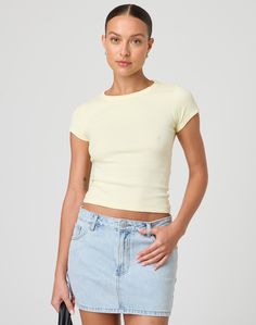 This top is a neccessary basic with a crew neckline and fitted baby tee style. Trendy Short Sleeve Crew Neck Top For Layering, Basic Stretch Short Sleeve Top For Everyday, Basic Everyday Tops With Scoop Neck, Basic Scoop Neck Tops For Everyday, Basic Fitted Cropped T-shirt, Basic Short Sleeve Scoop Neck Top For Spring, Basic Short Sleeve Top With Scoop Neck For Spring, Basic Short Sleeve Top For Spring, Trendy Crew Neck Basic Top