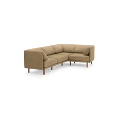 a beige sectional couch with two wooden legs and one arm facing the back, on an isolated