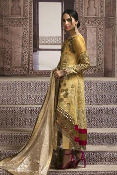 Semi-stitched Gold Chanderi Lawn Suit, Gold Resham Embroidered Lawn Suit For Wedding, Gold Resham Embroidery Lawn Suit For Wedding, Gold Lawn Suit With Dabka For Wedding, Gold Lawn Suit With Resham Embroidery For Wedding, Transitional Gold Dress With Dabka Detail, Gold Jamawar Dress With Dupatta, Gold Unstitched Suit For Eid, Gold Lawn Suit With Traditional Drape