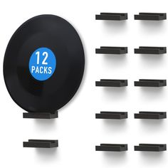 twelve black shelves with 12 packs of blue stickers on the front and one pack of black ones behind them