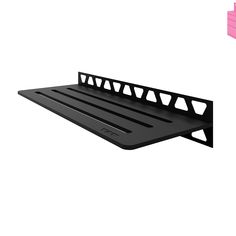 a black shelf that is on top of a white wall