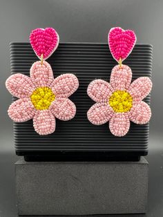 This is a beautiful Quirky beaded Earrings in Magenta and Pink Flower design. Very light weight to wear and looks good on any attire. This is very beautiful to look at and a perfect one for regular wear and also parties.  Color : Magenta, Pink, Yellow length : 2.75 inch width : 1.75 inch Each earring Weight : 6.8 grams Material : Beads, Fabric Beautiful High Quality, premium jewelry. Free US standard shipping. Hand crafted in India with the finest design, this earring is of premium quality and u Pink Flower Design, Beads Fabric, Magenta Flowers, Boho Earring, Premium Jewelry, Beaded Earring, Quirky Earrings, Color Magenta, Earring Handmade